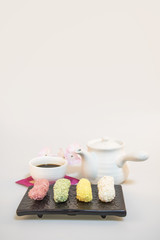 Korea traditional cookies on the dish. cherry blossom. teapot. tea