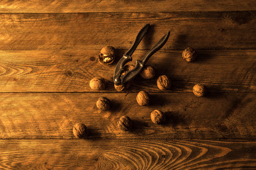 Nuts with walnut on a vintage wooden table