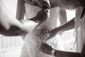Bride Getting Dressed for her Wedding