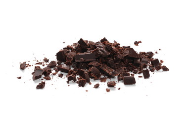 Pile chopped, milled cocoa chocolate bars and shavings isolated on white background