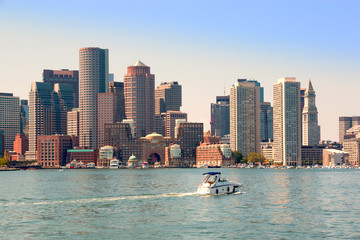 Boston harbor and cityscape. Skyline of downtown district office and apartment buildings on the waterfront. Boston, Massachusetts, USA