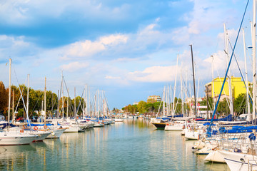 Obraz premium Summer view of pier with ships, yachts and other boats in Rimini, Italy
