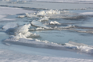 Fototapeta na wymiar Cracks with ice crystals on frozen river , Ob reservoir, Siberia, Russia