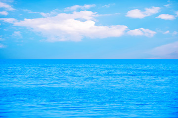 Fototapeta na wymiar Water and sky in blue color at sea for background