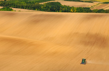 Tractor prepare field for a next season