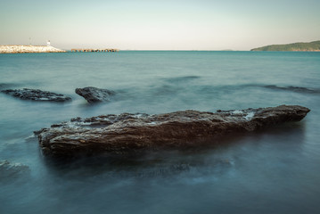 Sea wave impact with rock streak like a boil water with clear sky, Khao Leam Ya National Park at Rayong of Thailand (Long Exposure Technique photograph)