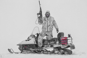 snowmobiling on the river in winter