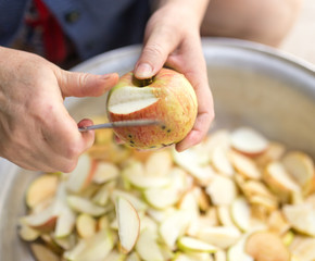 cutting an apple with a knife