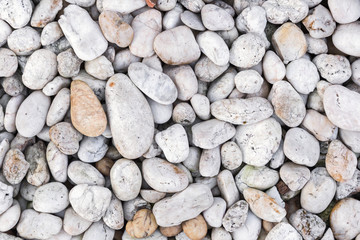 Naklejka premium Stone pebbles texture or stone pebbles background for interior design business. exterior decoration and industrial construction idea concept design. Stone pebbles motifs that occurs natural.