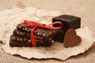 Chocolate bars with nuts and chocolate candies rectangular shape and in shape of heart