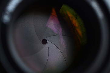 Fragment of a portrait lens for a modern SLR camera. A photograph of a wide-aperture lens with a...