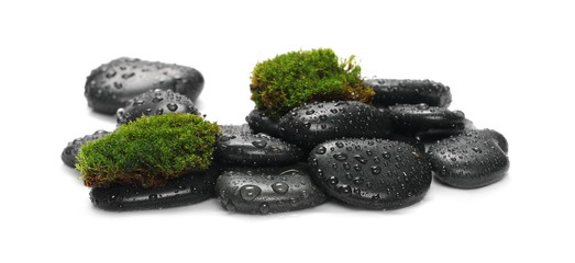 Green wet moss with black spa rocks and drops of water isolated on white background