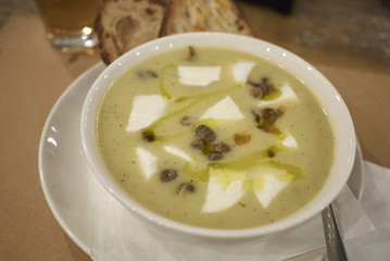 Potato soup with burrata cheese and capers