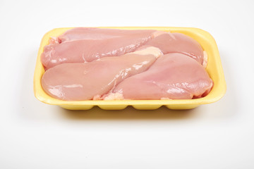 Raw chicken fillet package isolated on white background.