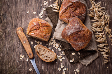 Fresh homemade buns on rustic background