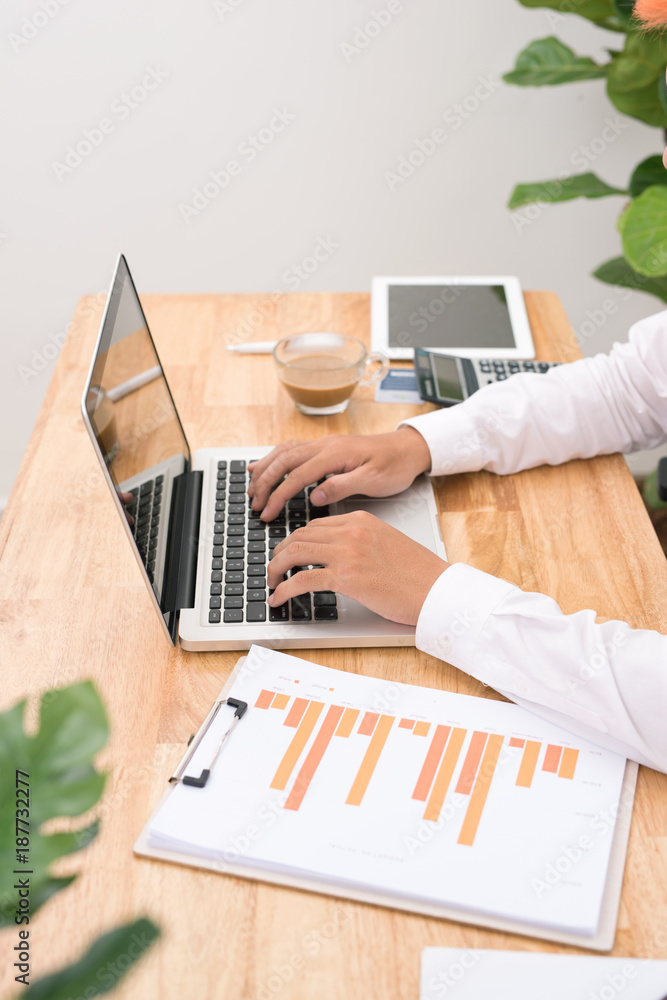 Poster man working on laptop from home. counting financial data.