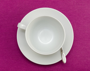 Obraz na płótnie Canvas Coffee empty cup on purple tablecloth