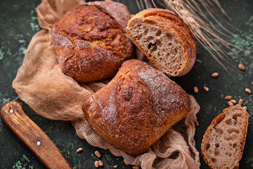 Fresh homemade buns on rustic background