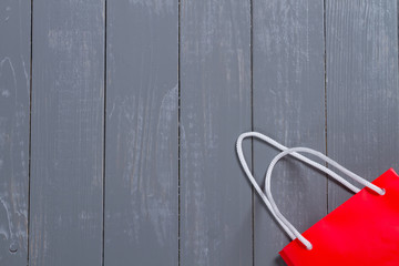 Red paper bag on a background top view