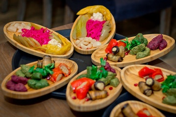 Wooden plate with pickled vegetables