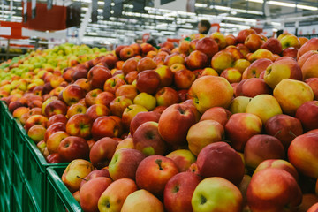 Apples on supermarket shelves