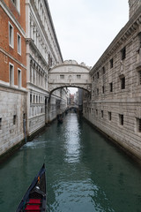 Fototapeta na wymiar Bridge of sighs with gondolas - Venice , Italy 