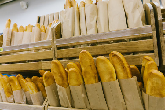 Focus on shelves with bread in a supermarket