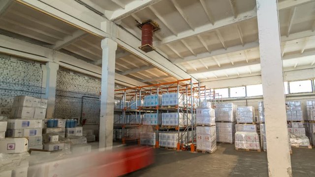 logistic, storage, shipment, industry and manufacturing concept timelapse hyperlapse - forklift loader and cargo boxes storing at warehouse