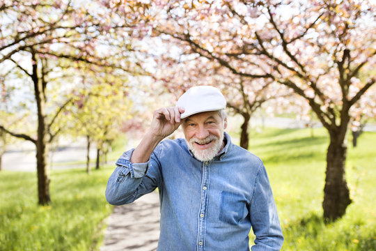 Senior man in love outside in spring nature.