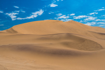 Fototapeta na wymiar Dune 7, a very large sand dune area at the edge of the Namib desert near the harbor city of Walvis Bay, Namib-Naukluft National Park, Namibia.