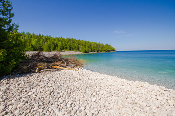 Crystal water and  white stony coastline   at Bruce Peninsula National Park Ontario Canada