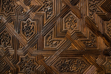 Texture of a wooden door with symmetrical patterns