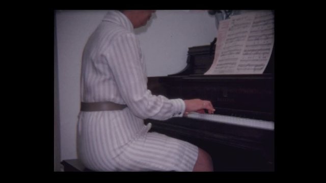 1968 Womany plays piano