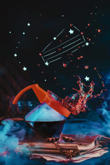Cake constellation with coffee pot for pour over brewing method, beautiful coffee splash on a dark background. Action food photography. Alternative coffee brewing concept. © DinaBelenko