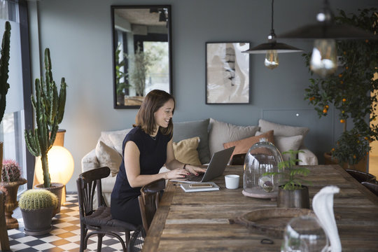 Woman working at a laptop