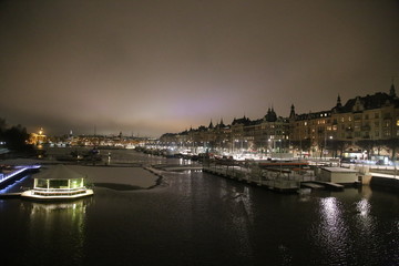 Fototapeta premium night embankment in winter Stockholm, old ships, ellumination