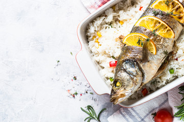 Fish seabass baked with rice and vegetables.