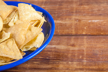 Nachos corn chips on wooden talbe
