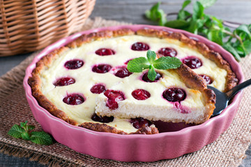 Homemade pie with cottage cheese and cherries