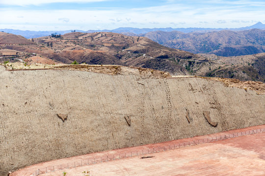 Real dinosaur footprint imprinted in the rock. Side view. Nacional Park in Sucre, Bolivia