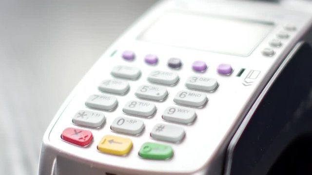 Customer paying with NFC technology by mobile phone on terminal. 4K UltraHD video