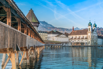 The Kapellbrücke (Chapel Bridge), a covered wooden footbridge spanning diagonally across the Reuss in the city of Lucerne in central Switzerland.