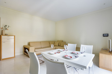 Interior of a cozy living room in light colours in a private studio