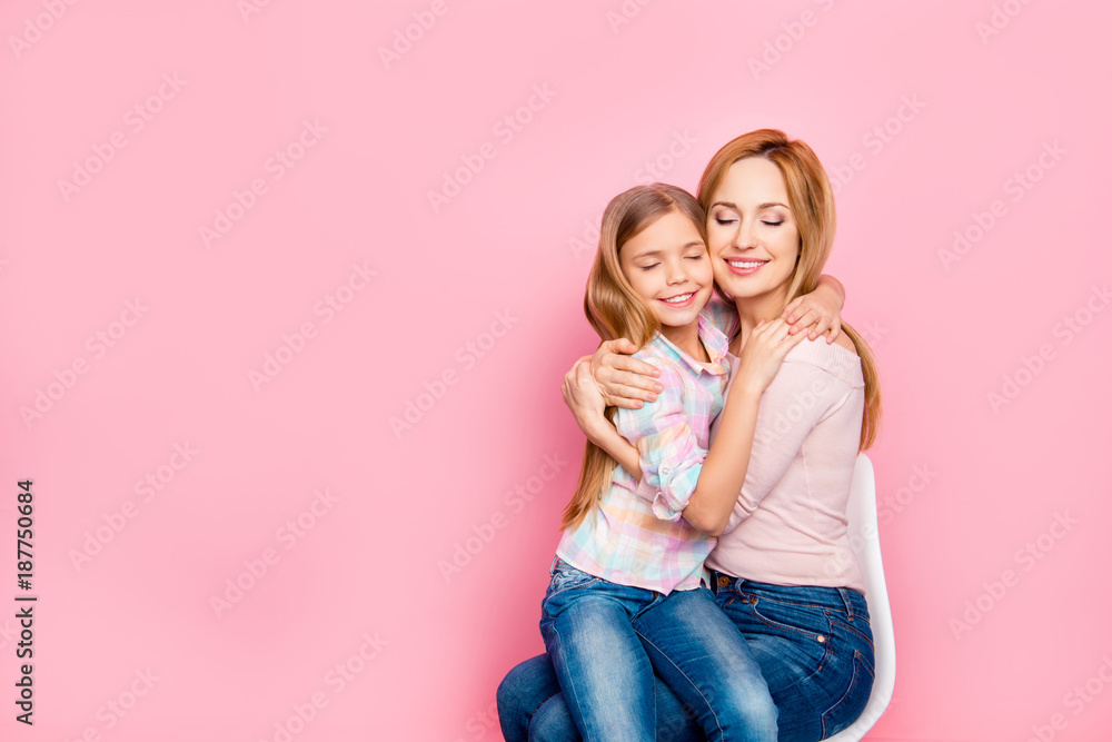 Poster Close up portrait of lovely, charming daughter sitting on mom's hands over pink background, embracing with mum, close eyes, leisure, holidays, weekend, comfort, mother, women's day