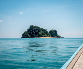 The small island of Koh Nok or Ko Nok in Thailand. View from longtail boat.