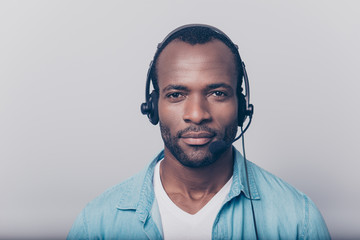 Close up portrait of confident cheerful professional smart clever intelligent with bristle stubble guy wearing casual clothing using headphones for working isolated on gray background