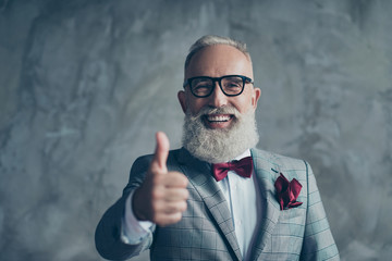 Well done! Portrait of cheerful man with beaming toothy smile sharp-dressed with burgundy handkerchief in pocket elegant stylish trendy recommending to visit barbershop isolated on concrete background