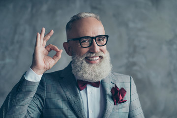 Close up portrait of funny excited cheerful with groomed stylish moustache hipster grandfather...