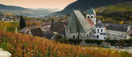 Novacella Monastery with vineyards during autumn season. Located in Varna, Bolzano, Trentino...