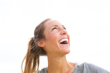 happy young beautiful woman laughing outside